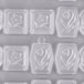 A white Matfer Bourgeat plastic mold with flower designs in circles.