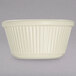 A white Carlisle fluted ramekin on a white surface with a black border.