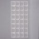 A clear plastic Chocolate World tray with square compartments.