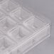 A clear polycarbonate tray with 32 square compartments.
