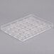 A clear plastic tray with rectangular tulip shapes.
