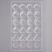 A clear plastic Matfer Bourgeat chocolate mold with different shapes.