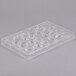 A clear plastic Matfer Bourgeat chocolate mold tray with 24 compartments.