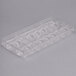 A clear plastic Chocolate World quenelle chocolate mold with 16 compartments.