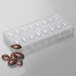 A Chocolate World plastic mold with a chocolate quenelle candy inside.