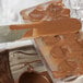 A knife cutting chocolate on a Matfer Bourgeat plastic mold.