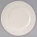 A Tuxton Meridian ivory china plate with a swirl rim.