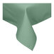 A seafoam green rectangular tablecloth with a folded edge.