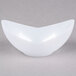 A white bowl with a curved edge.