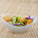 A white Fineline Tiny Tureens bowl filled with salad.