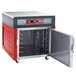 A red and grey Metro stainless steel hot holding cabinet with a door open.