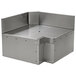 A stainless steel Eagle Group Spec-Bar inner corner workboard with holes over a bar sink.