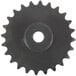 A close-up of a black gear with a hole in the middle.