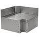 A stainless steel Eagle Group Spec-Bar inner corner workboard with holes in a metal corner.