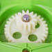 A green plastic container with white and yellow gears inside.