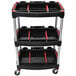 A black Luxor tool cart with three shelves and wheels.