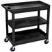 A black Luxor utility cart with three shelves and wheels.