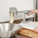 a person's hand in gloves over a white counter