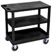 A black Luxor utility cart with wheels.