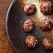 A plate of brown cookies with Regal Coarse Sea Salt on top.