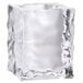 A clear glass ice cube candle holder with a rough surface.