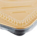 A Durable Packaging aluminum foil entree container with a clear plastic lid.