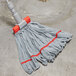 A red Unger SmartColor microfiber string mop head on a mop.