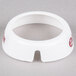 A white plastic Tablecraft salad dressing dispenser collar with maroon lettering.