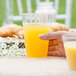 a close-up of a glass of orange liquid