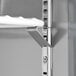 A metal shelf in an Avantco worktop refrigerator.