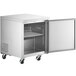 An Avantco stainless steel undercounter refrigerator with a door open.