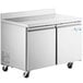 An Avantco stainless steel worktop freezer with two doors on wheels.