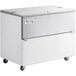 An Avantco stainless steel school milk cooler with wheels.