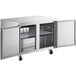 An Avantco stainless steel undercounter freezer with two doors open.