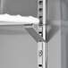 An Avantco worktop refrigerator shelf with a metal hook on it.