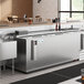 An Avantco stainless steel horizontal bottle cooler on a counter.