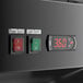 The electronic control panel for an Avantco black merchandiser refrigerator.