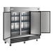 A large stainless steel reach-in refrigerator with three solid doors and interior shelving.