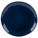 A close-up of a blue GET Cosmo melamine plate with a white irregular rim.