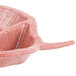 A pink polyethylene bowl with a handle.