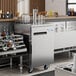 An Avantco stainless steel kegerator with a beer tap.
