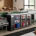 An Avantco back bar refrigerator with drinks on the shelf.