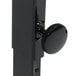 A black metal object with a round knob on the top.