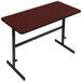 A brown rectangular table with a black frame and a red top.