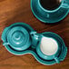 A teal blue Fiesta sugar and creamer tray set.