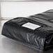 A black Intedge insulated delivery bag with a white label on it.