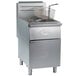 A Globe stainless steel floor gas fryer with a basket.