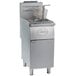 A Globe stainless steel floor gas fryer with a basket.