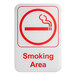 A white rectangular sign with red lettering and a red circle with a cigarette in the middle.