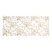 A white glassine candy box pad with a gold floral pattern.